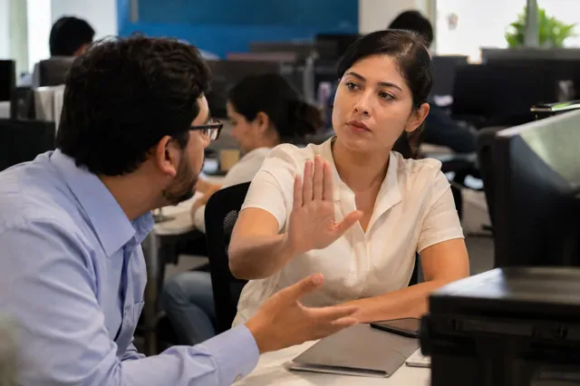 Employee firmly expresses a boundary during a workplace conversation.