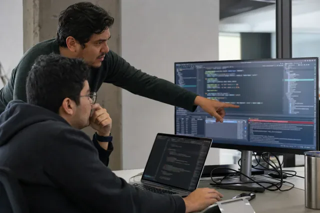 Engineers reproduce a bug during a code review.